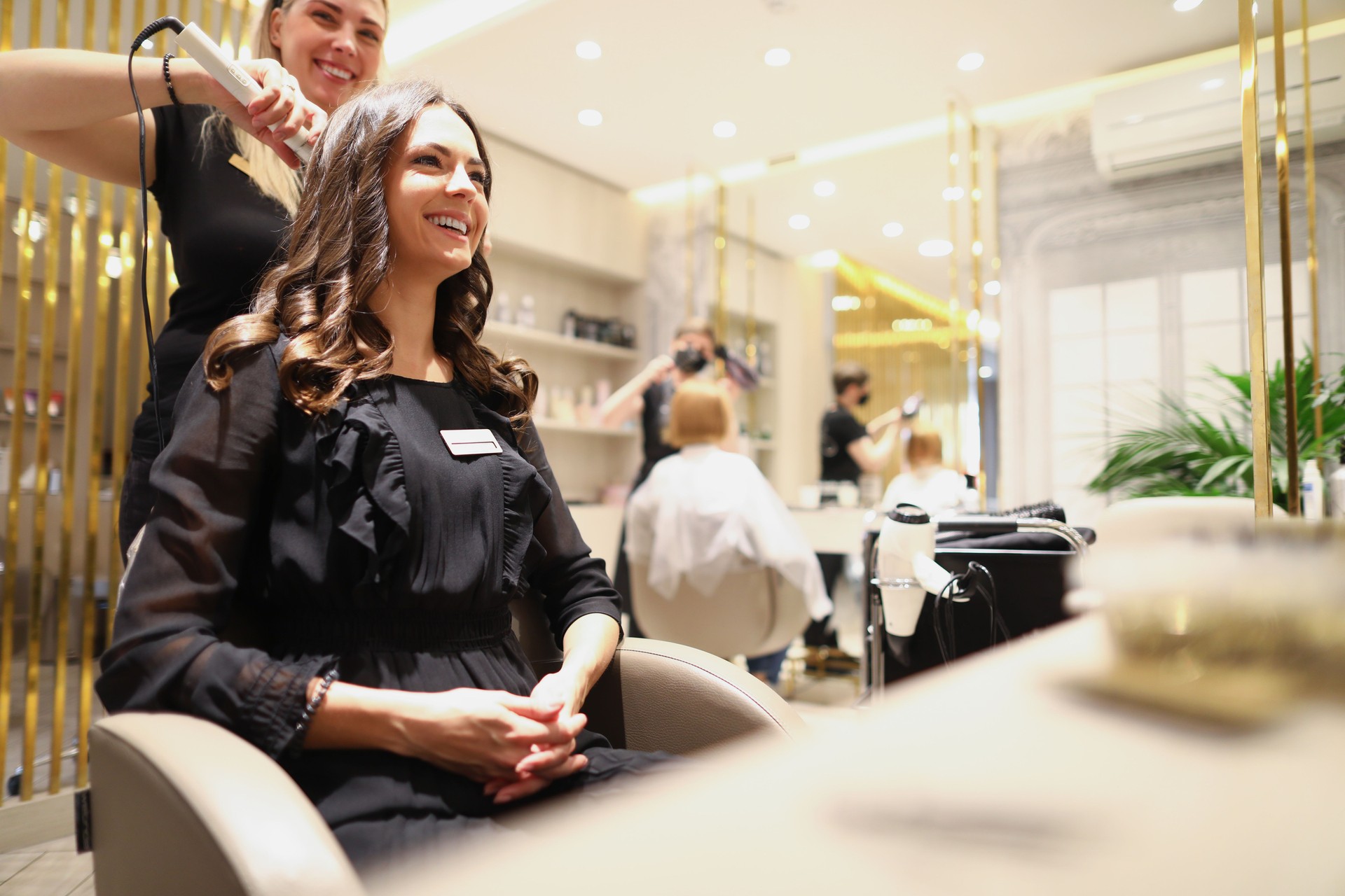 Beautiful woman sitting in the barber chair